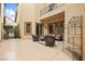 Cozy patio setting with comfortable seating and views of the lush landscape at 9172 Tudor Park Pl, Las Vegas, NV 89145