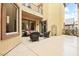 Inviting patio area with outdoor seating and a view of the surrounding property at 9172 Tudor Park Pl, Las Vegas, NV 89145