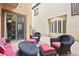 Charming patio seating area with comfortable furniture and decorative lighting at 9172 Tudor Park Pl, Las Vegas, NV 89145