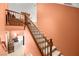 Carpeted staircase leads to the upper level, providing seamless transition and showcasing the home's design at 9172 Tudor Park Pl, Las Vegas, NV 89145