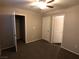 Spacious bedroom with carpet, walk-in closet, and white doors at 9359 Brigham Ave, Las Vegas, NV 89178