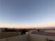 Scenic rooftop view with desert landscape featuring palm trees and mountain range in the distance at 9359 Brigham Ave, Las Vegas, NV 89178