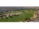 Aerial view of a golf course community with meticulously maintained green fairways at 949 Via Stellato St, Henderson, NV 89011