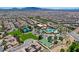 Aerial view showcasing the community center with pools, tennis courts, and manicured lawns at 949 Via Stellato St, Henderson, NV 89011