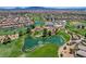 Scenic aerial image featuring a golf course with ponds and lush greenery in a residential area at 949 Via Stellato St, Henderson, NV 89011