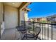 Balcony with dark metal table and chairs overlooking a neighborhood at 949 Via Stellato St, Henderson, NV 89011