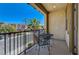 Balcony with views of neighborhood palm trees and street at 949 Via Stellato St, Henderson, NV 89011