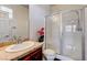 Bathroom with glass shower doors and marble countertop at 949 Via Stellato St, Henderson, NV 89011