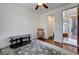 Bedroom with a rocking chair, dark wood flooring, and open entry at 949 Via Stellato St, Henderson, NV 89011