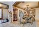 Dining room featuring a chandelier, decorative mirrors, and ornate furnishings at 949 Via Stellato St, Henderson, NV 89011