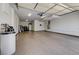 Spacious garage with epoxy floors, water heater, storage, and bright overhead lighting at 949 Via Stellato St, Henderson, NV 89011