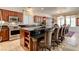 Gourmet kitchen with a large island, stainless steel appliances, and a breakfast nook at 949 Via Stellato St, Henderson, NV 89011
