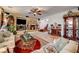 Comfortable living room featuring a fireplace, tile flooring, and stylish decor at 949 Via Stellato St, Henderson, NV 89011