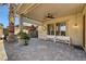 Spacious covered patio featuring brick pavers, ceiling fans, columns, and bench seating at 949 Via Stellato St, Henderson, NV 89011