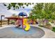 Community playground featuring colorful slides and play areas with shaded seating at 949 Via Stellato St, Henderson, NV 89011