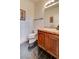 Classic powder room with vanity, granite countertop, and tiled flooring at 949 Via Stellato St, Henderson, NV 89011