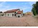 Backyard featuring rock landscaping, covered patio, and view of home exterior at 9529 Shallow Brook Cir, Las Vegas, NV 89117