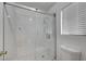 Bathroom with a new glass shower enclosure with new shower head and fixtures at 9529 Shallow Brook Cir, Las Vegas, NV 89117