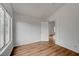 Bright bedroom with wood floors and an open doorway at 9529 Shallow Brook Cir, Las Vegas, NV 89117