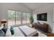 Bright bedroom featuring large windows, modern furniture, and stylish décor at 9529 Shallow Brook Cir, Las Vegas, NV 89117