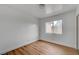 Cozy bedroom with wood floors and a bright window at 9529 Shallow Brook Cir, Las Vegas, NV 89117
