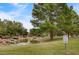 Community green space featuring pond, waterfall, trees, and grass at 9529 Shallow Brook Cir, Las Vegas, NV 89117