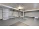 Spacious three car garage with finished walls and ceiling, and a door to the outside at 9529 Shallow Brook Cir, Las Vegas, NV 89117