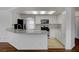 Modern kitchen with stainless steel appliances, countertops, and tile floors at 9529 Shallow Brook Cir, Las Vegas, NV 89117