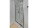 Modern shower with glass door, mosaic floor, and rainfall shower head at 9529 Shallow Brook Cir, Las Vegas, NV 89117