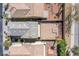 Aerial view of the house showing backyard with gravel and brick paver patio area and block fence perimeter at 9617 Fast Elk St, Las Vegas, NV 89143