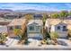 An aerial view of a charming two-story home in a well-planned community with mountain views at 9617 Fast Elk St, Las Vegas, NV 89143