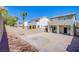 Brick wall-enclosed backyard with gravel surface and patio for outdoor entertaining at 9617 Fast Elk St, Las Vegas, NV 89143