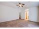 Spacious bedroom with neutral color scheme, carpet flooring, and ceiling fan at 9617 Fast Elk St, Las Vegas, NV 89143