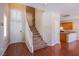 A spacious foyer showcases a staircase, hardwood floors, and a kitchen view at 9617 Fast Elk St, Las Vegas, NV 89143