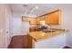 Modern kitchen showcases wood cabinets, stainless appliances, and granite counters at 9617 Fast Elk St, Las Vegas, NV 89143