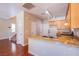 Bright kitchen features wood floors, granite countertops, and stainless steel sink at 9617 Fast Elk St, Las Vegas, NV 89143