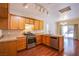 Stylish kitchen with stainless appliances, granite countertops, and backyard access at 9617 Fast Elk St, Las Vegas, NV 89143
