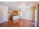 Spacious living area featuring hardwood floors, a kitchen view, and recessed lighting at 9617 Fast Elk St, Las Vegas, NV 89143