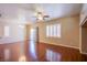 A spacious living room features hardwood floors, recessed lighting, and plantation shutters at 9617 Fast Elk St, Las Vegas, NV 89143