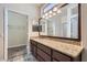 Bathroom featuring a large vanity and access to the walk-in closet and shower at 9920 Netherton Dr, Las Vegas, NV 89134