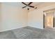 Bedroom featuring neutral carpet, fan, and plenty of space at 9920 Netherton Dr, Las Vegas, NV 89134