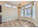 Bright breakfast nook with lots of natural light and a modern chandelier at 9920 Netherton Dr, Las Vegas, NV 89134