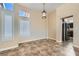 Dining area filled with natural light showcasing tile floors and pendant lighting at 9920 Netherton Dr, Las Vegas, NV 89134