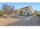 Attractive home featuring desert landscaping, a tiled roof, and charming curb appeal at 9920 Netherton Dr, Las Vegas, NV 89134