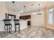 Spacious kitchen featuring modern lighting and a breakfast bar with seating for two at 9920 Netherton Dr, Las Vegas, NV 89134
