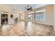 Open living space with tile flooring, high ceilings, and natural light at 9920 Netherton Dr, Las Vegas, NV 89134