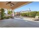 Inviting covered patio with comfortable lounge chairs and a well-manicured backyard at 9920 Netherton Dr, Las Vegas, NV 89134