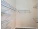 Walk-in closet with ample storage, including shelving and rods at 9920 Netherton Dr, Las Vegas, NV 89134