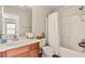 Bright bathroom featuring a vanity with a white countertop and a shower-tub combo at 10133 Longoria St, Las Vegas, NV 89178