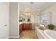 Inviting bathroom includes soaking tub, glass shower, and ample vanity space at 10133 Longoria St, Las Vegas, NV 89178